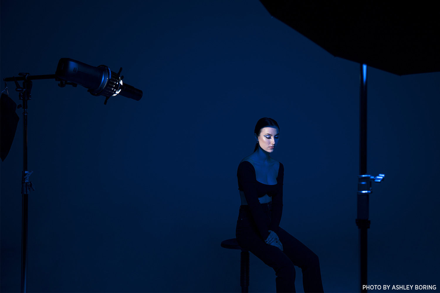 Optical Spot in use shaping precise beams of light for a creative photoshoot.