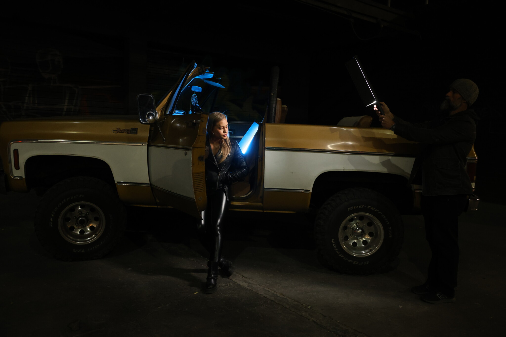 Behind the scenes woman's sitting in yellow car