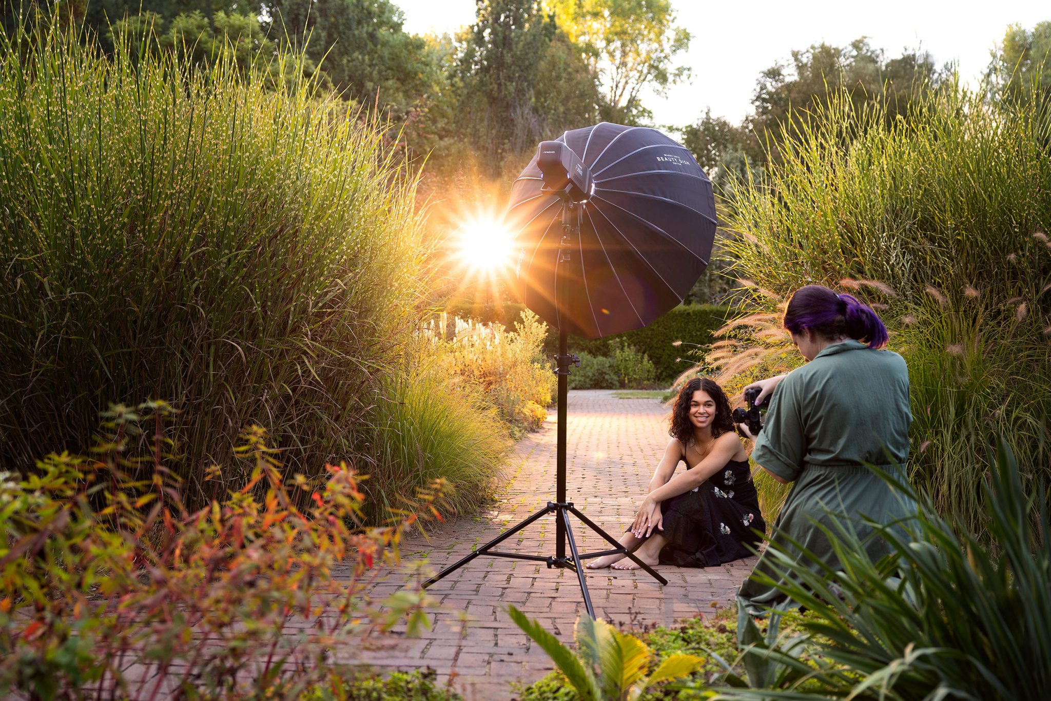 Behind-the-scenes view of recreating golden hour using a high, gelled backlight and simple front fill light.