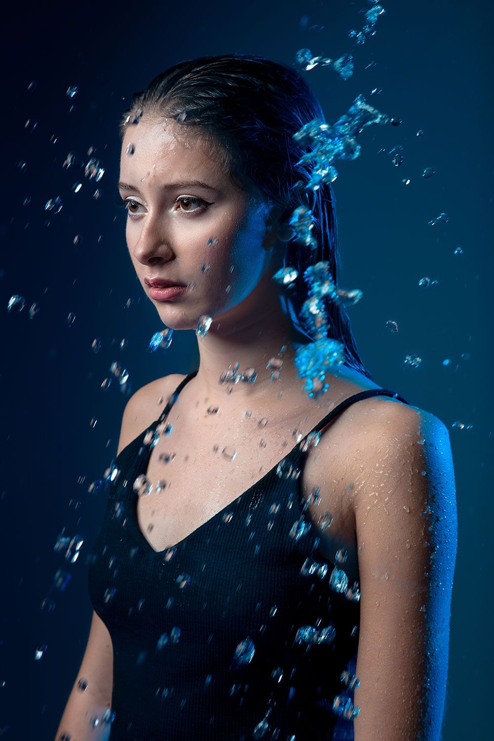 Image of a girl with water droplets around her