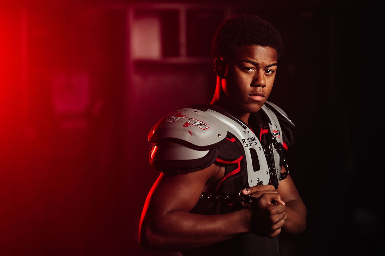 Dark side of college sports concept with high contrast lighting on