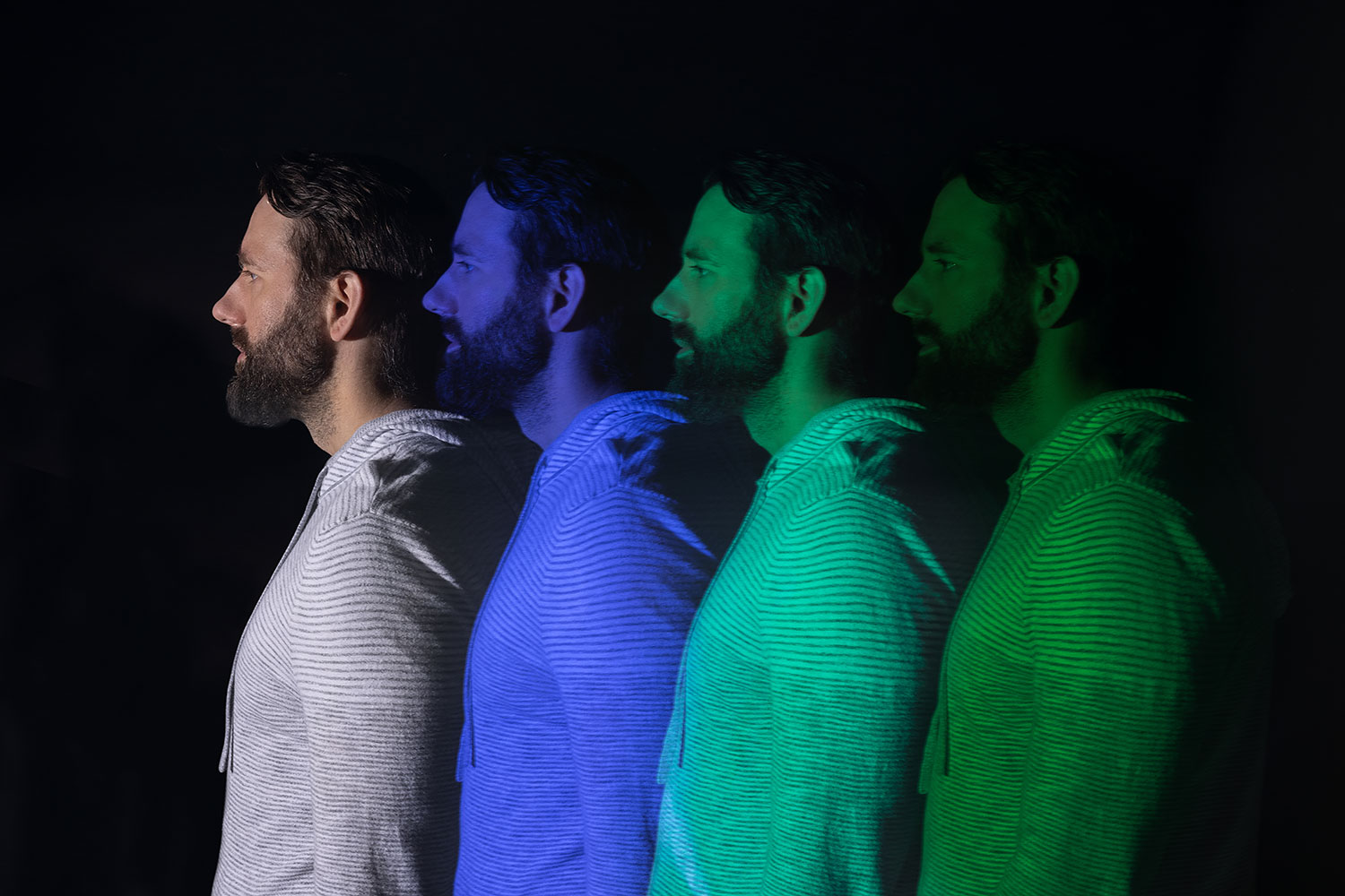 Man's profile layered in multiple different colors