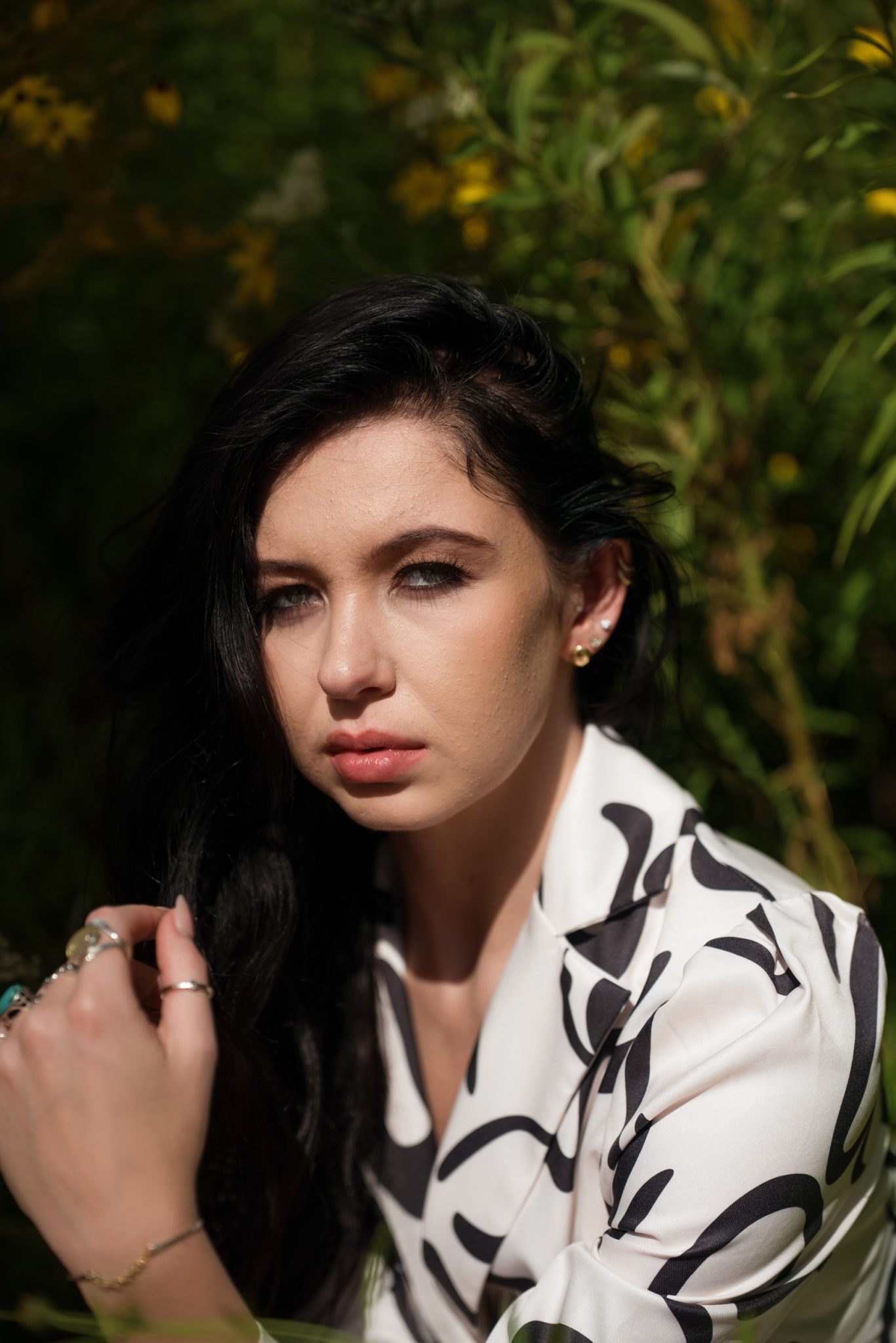 Before: Harsh sunlight creates strong shadows under the eyes and nose with bright highlights on the skin.