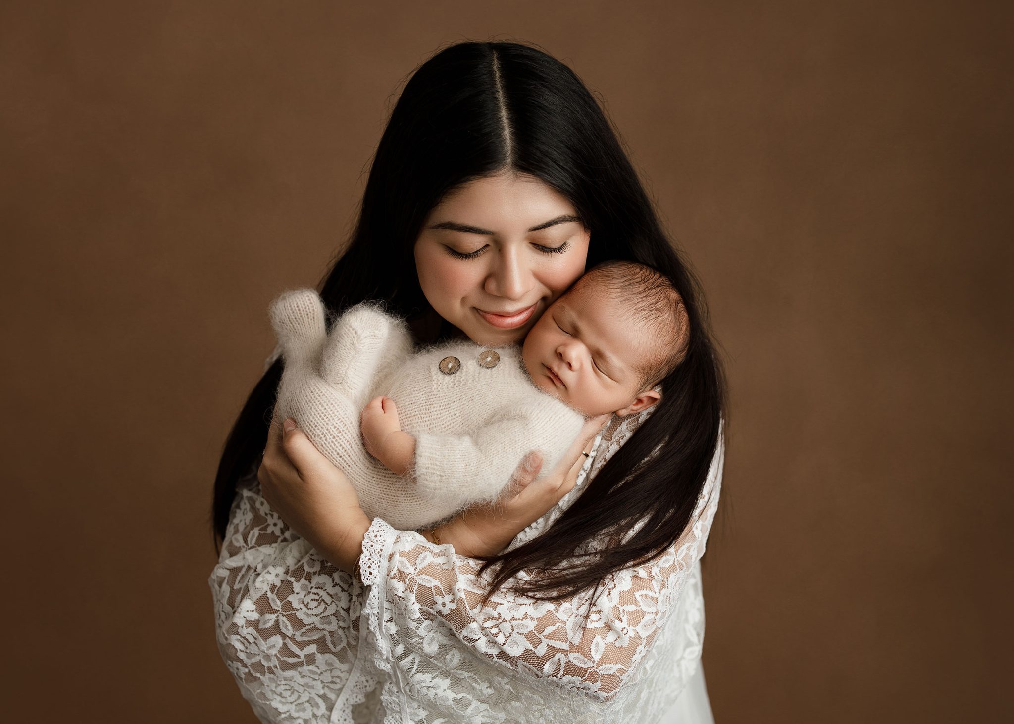 Mom and baby portrait lit with one FJ400 II and 7-ft umbrella for soft, flattering light.