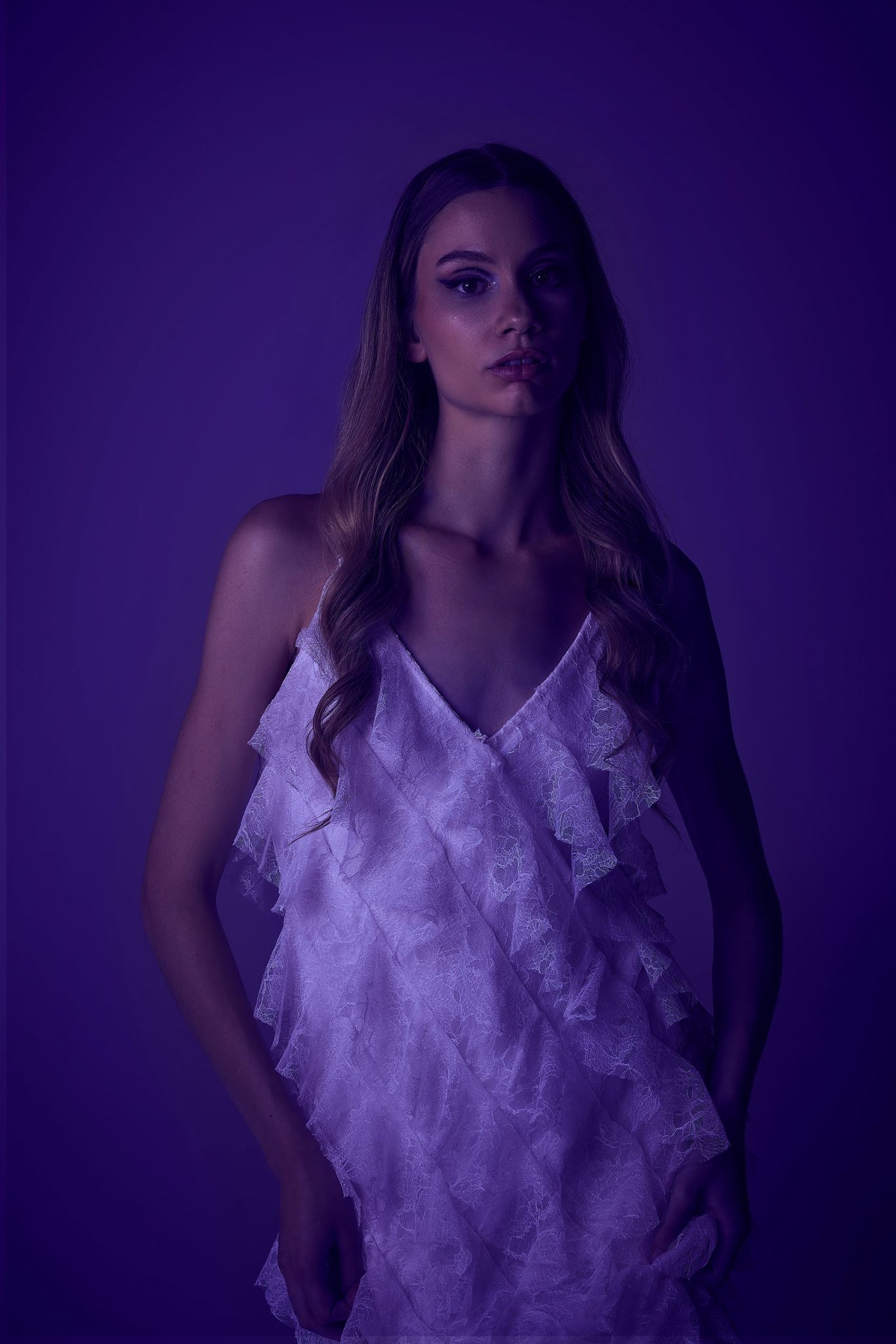 Fill light only using FJ400 with Vivid Purple FlexiGel and 53-inch Deep Umbrella model with gelled vivid purple fill light