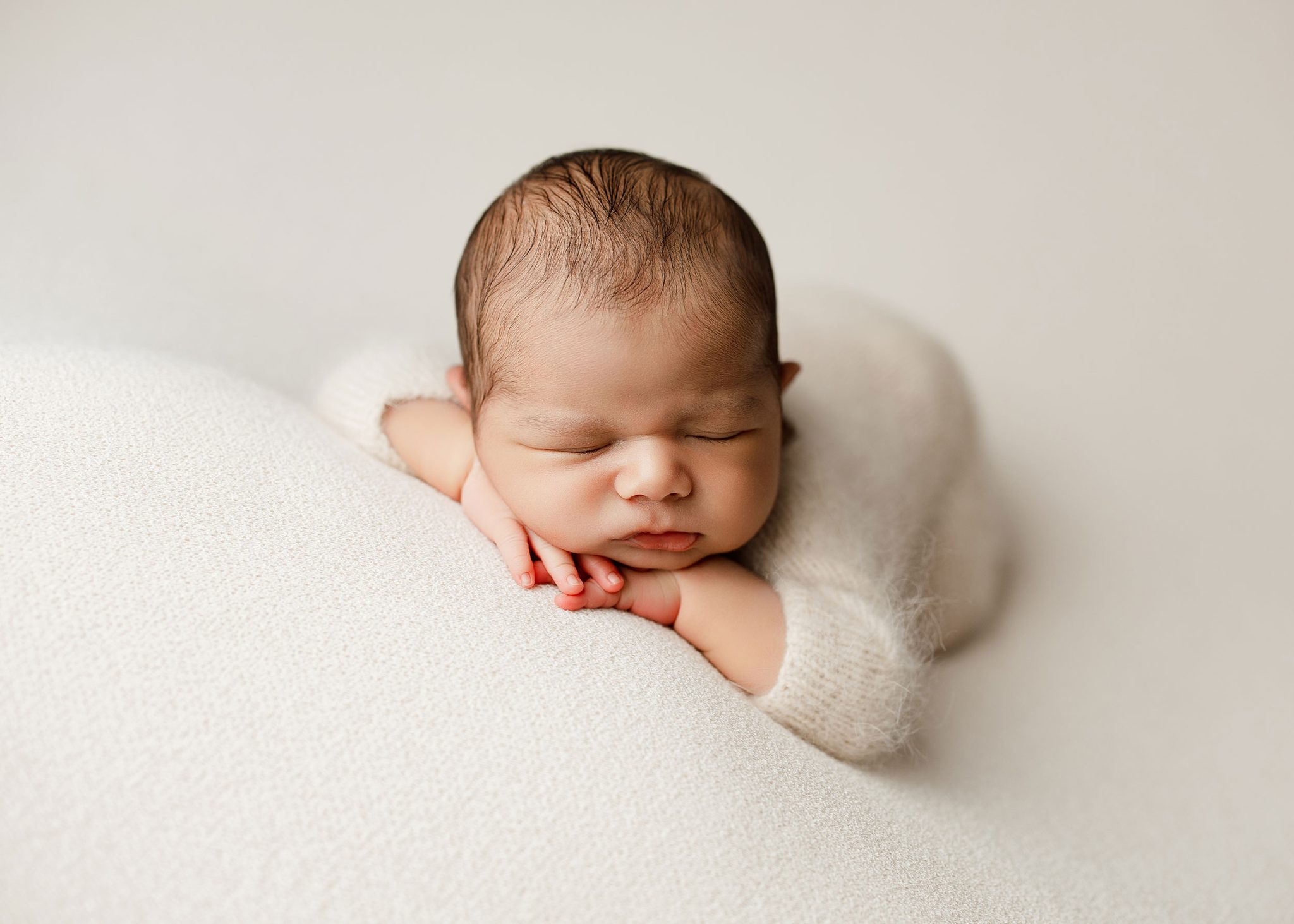 Tabletop Final uses a single Westcott FJ400 II and 7-ft white umbrella for soft, even newborn lighting.