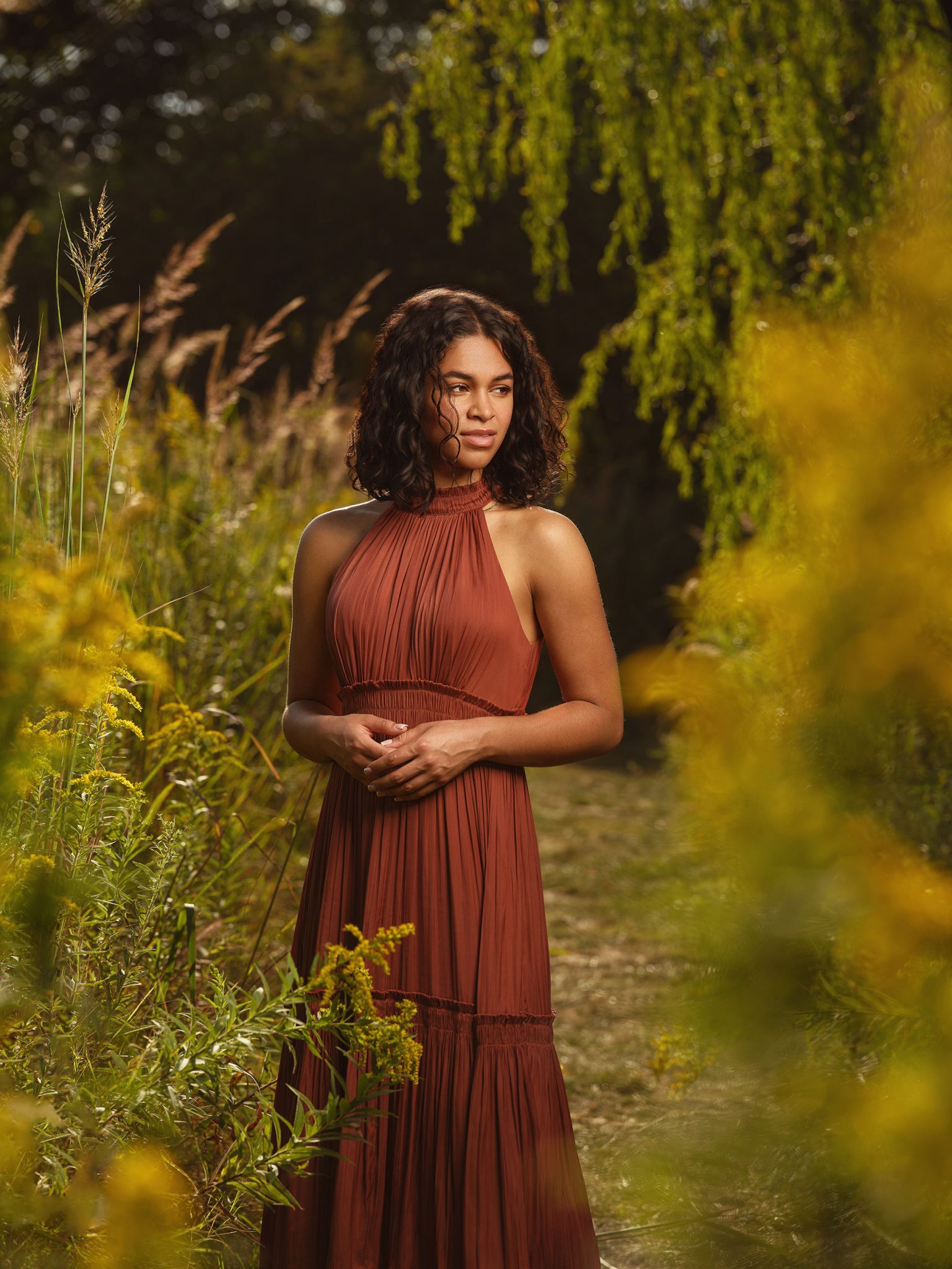 Warm golden hour glow combined with beauty dish lighting to keep detail in both the background and the subject.
