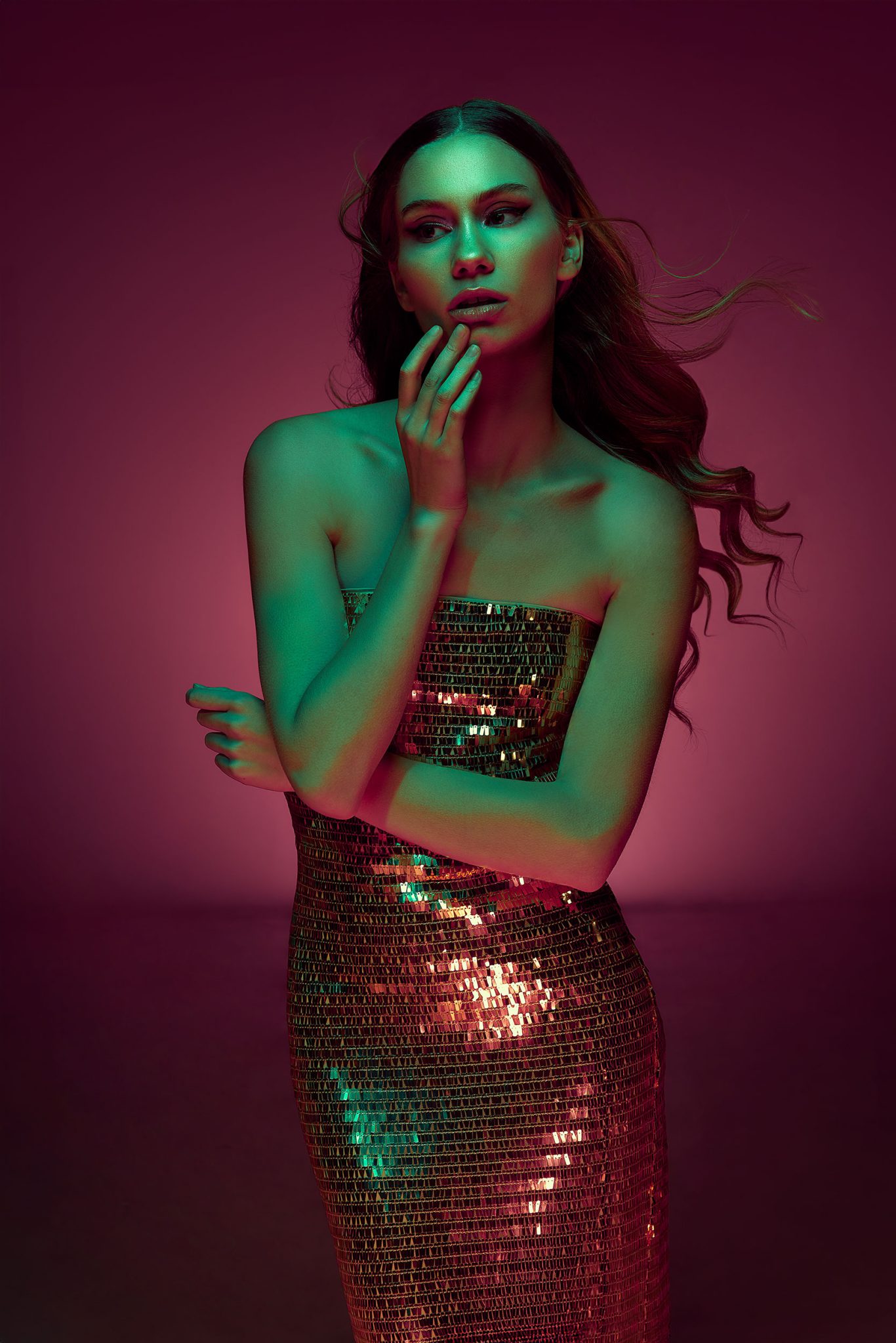Final portrait showing bold contrast with teal and pink FlexiGels Model shot with teal and pink gels