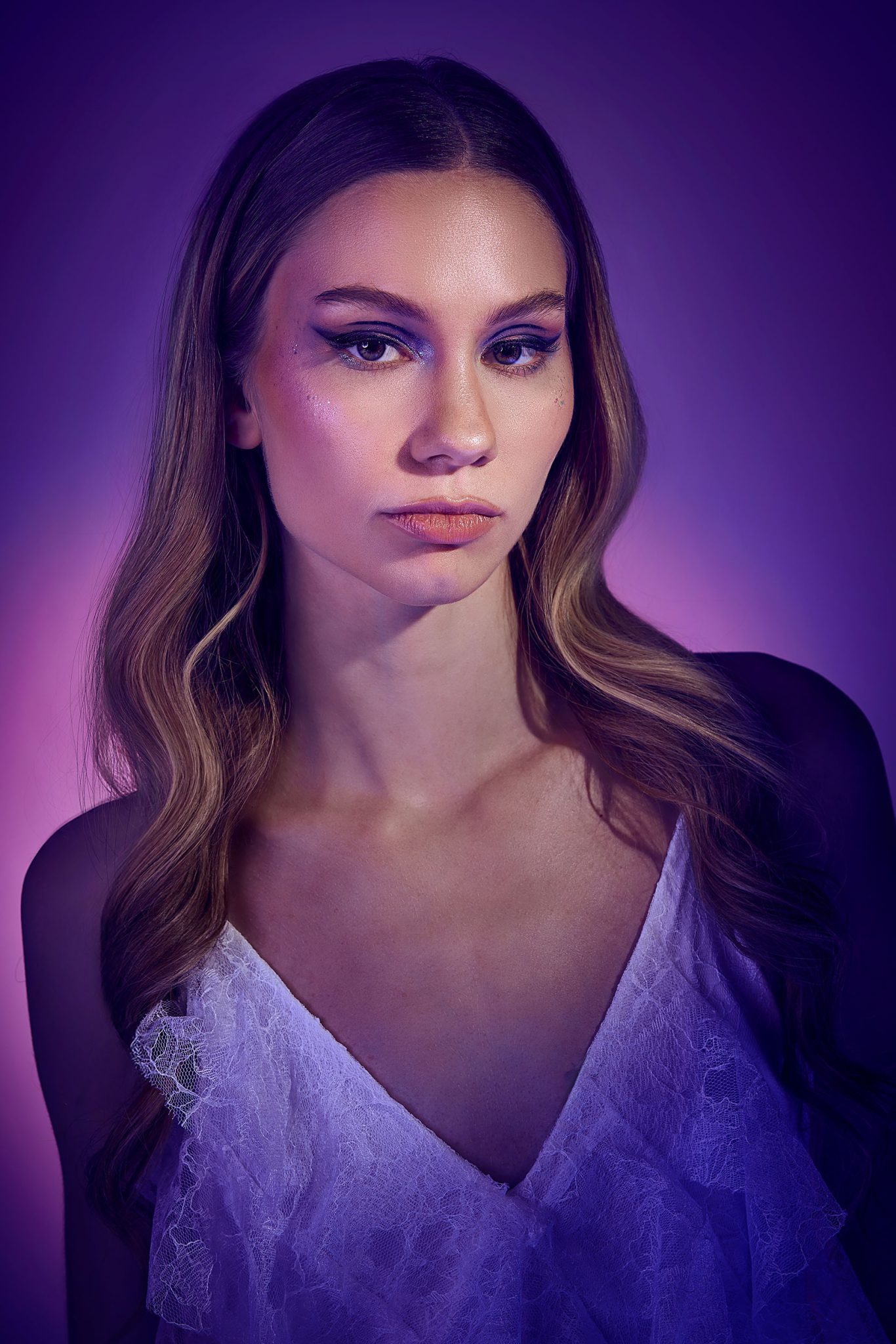 Final portrait with soft blended tones created using vivid purple pink and blue FlexiGels Model shot with blended gelled colors