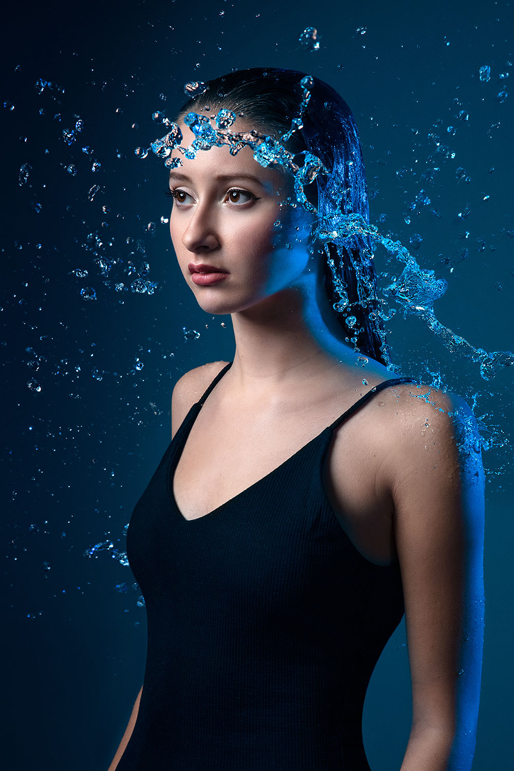 Image of a girl with water droplets around her