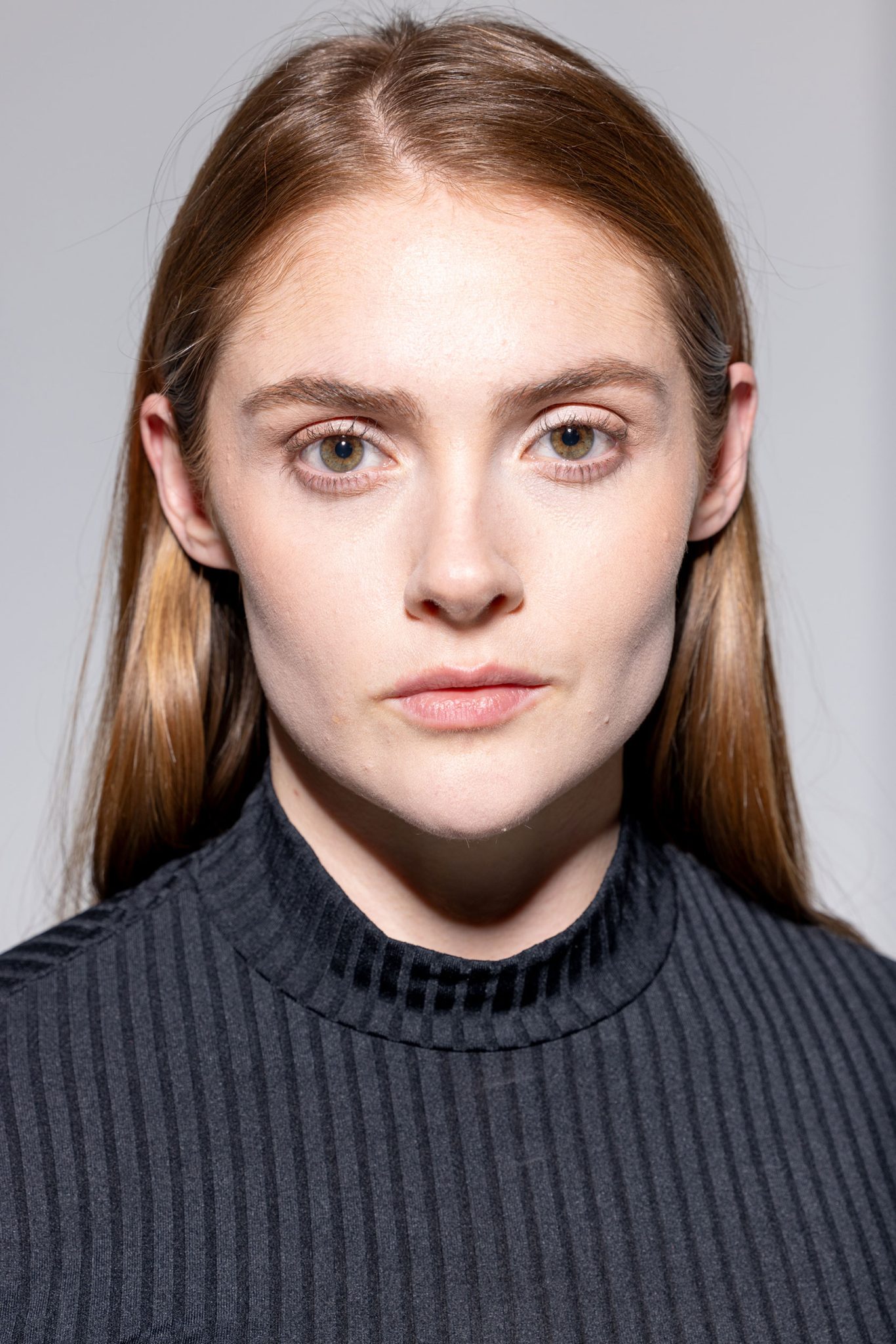 Closeup Headshot with Hard Light: Shows strong shadows and crisp facial detail created by hard beauty dish lighting