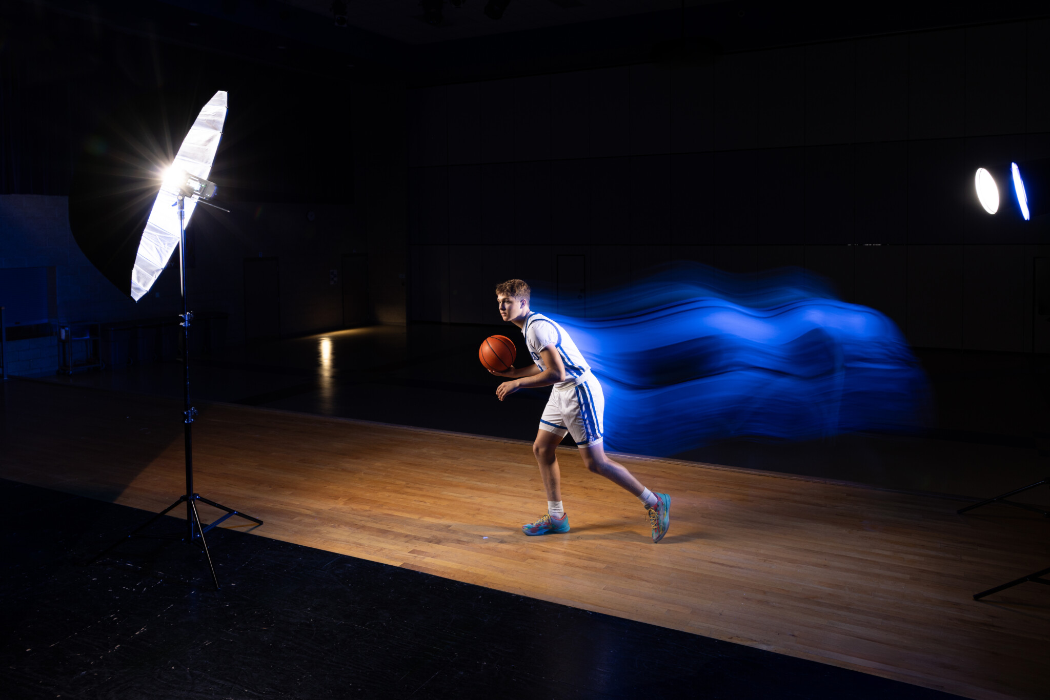 BTS photo demonstrating the process of light trails Behind the scenes action shot of a basketball player with light trails