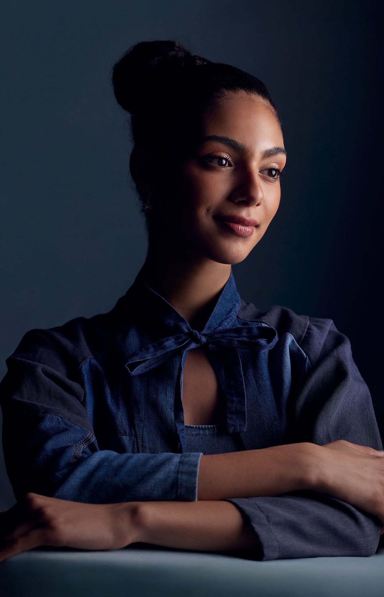 Light placed farther behind the subject for dramatic shadows and high contrast adding depth and mood to the portrait Light placed farther behind the subject for dramatic shadows and high contrast adding depth and mood to the portrait