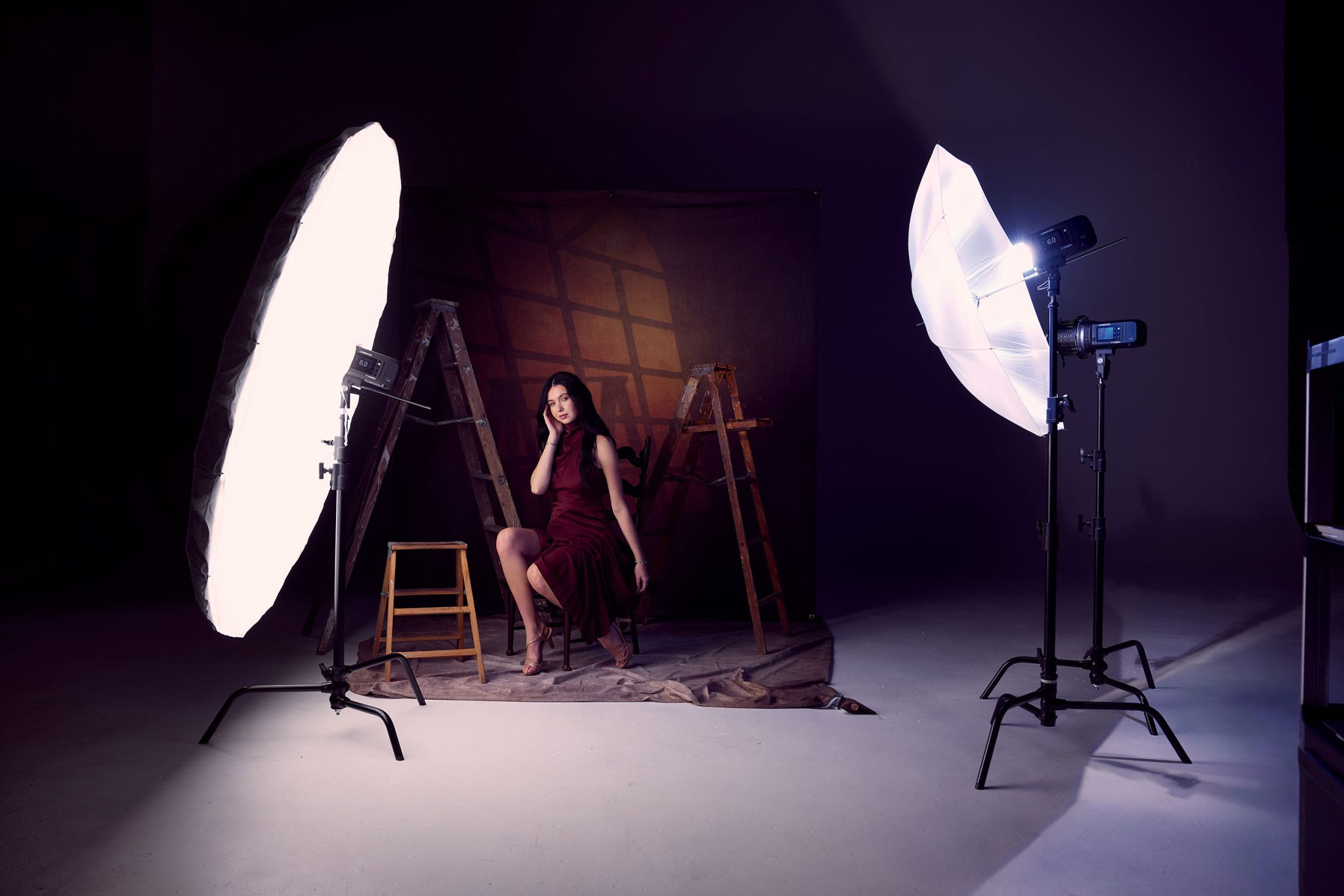Photographer Ashley Boring’s portrait lighting setup Photographer Ashley Boring’s portrait lighting setup: FJ400 II with 7' umbrella key, optical spot background, and gelled fill for subtle color contrast