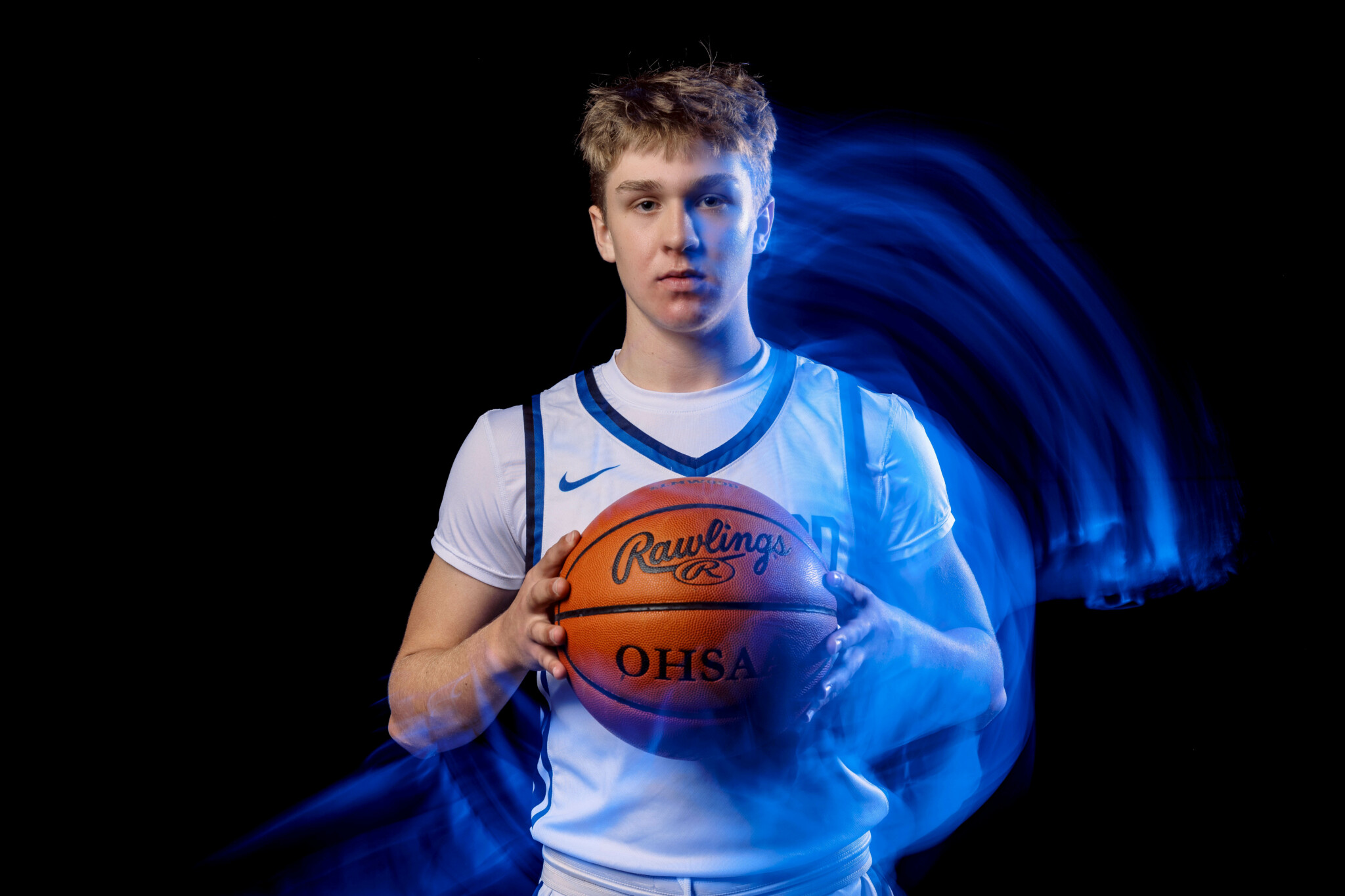 Light Trails Created by Rotating the Camera Basketball player staring at the camera with light trails around him