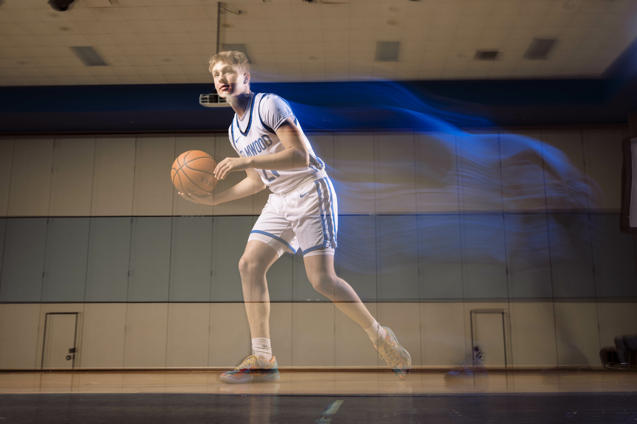 Light Trails with Ambient Lighting On Picture of a basketball player with ambient lighting on and light trails