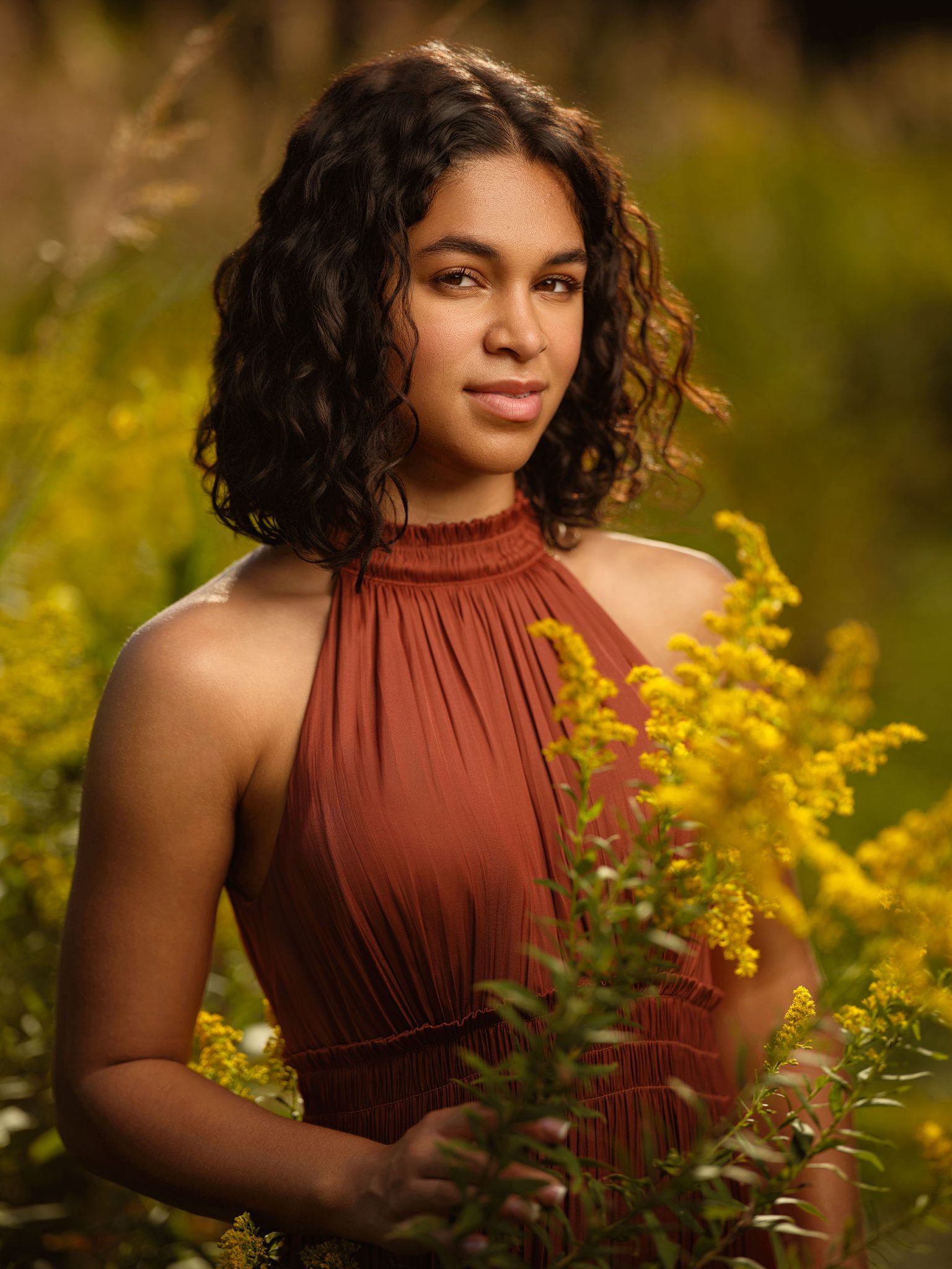 Golden hour portrait using the sun as a natural hair light with added fill from the Westcott FJ800 for soft, balanced lighting.