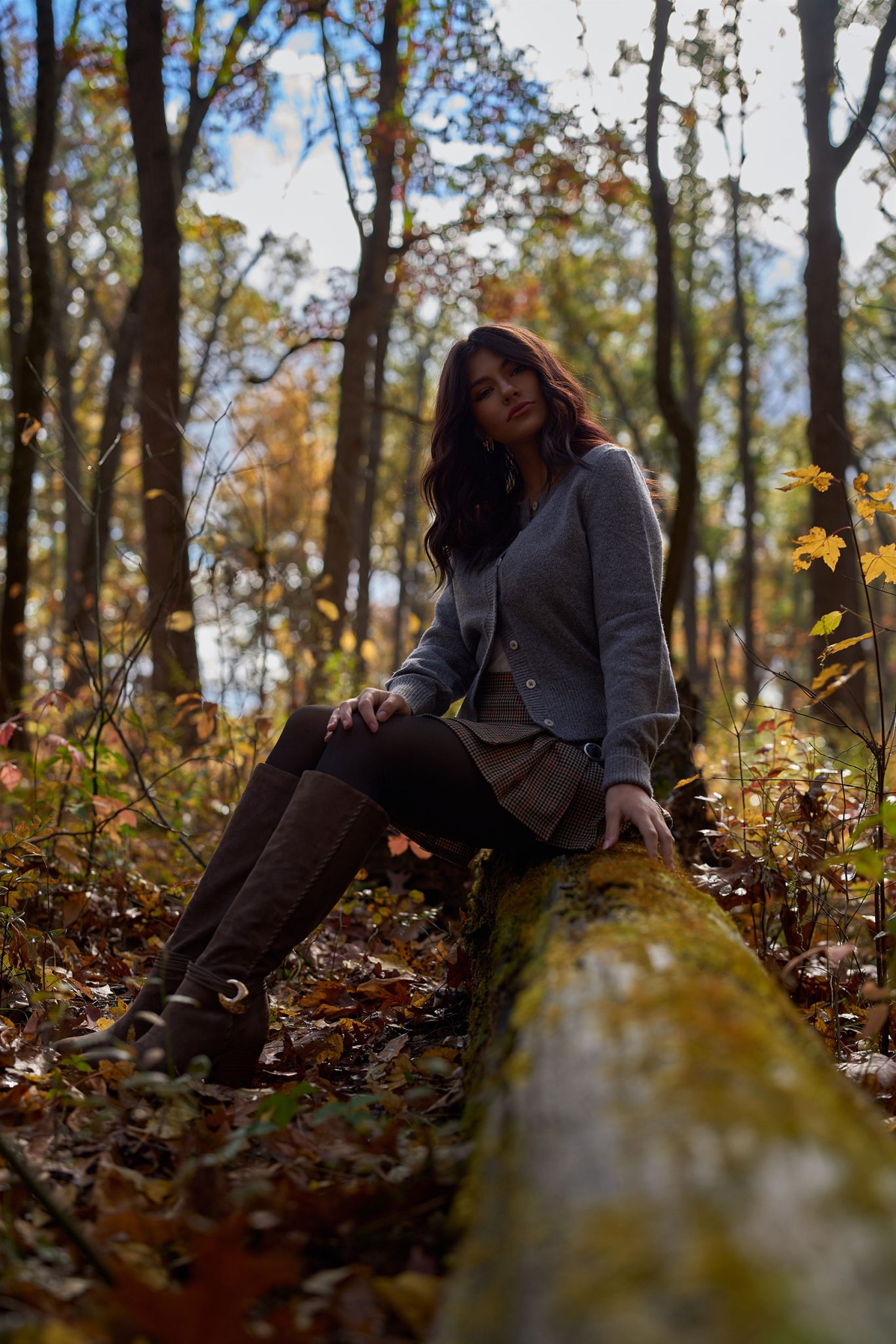 Wide outdoor portrait using natural light showing the subject darker against a bright background