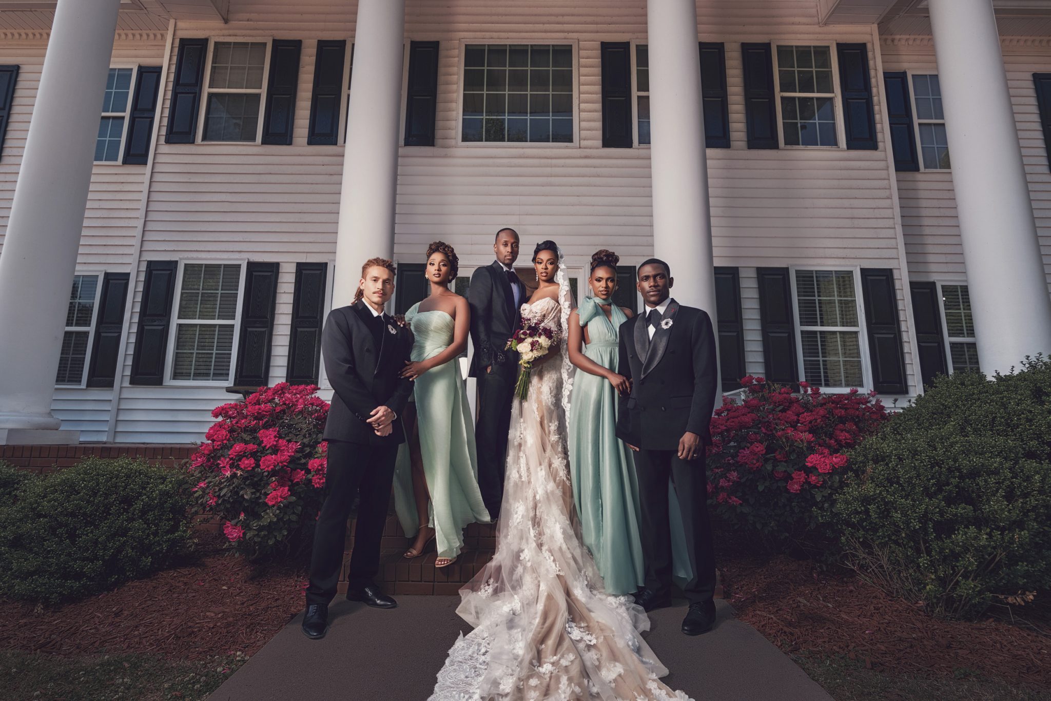Relaxed posing with subtle weight shifts and hand placement for a cohesive group.