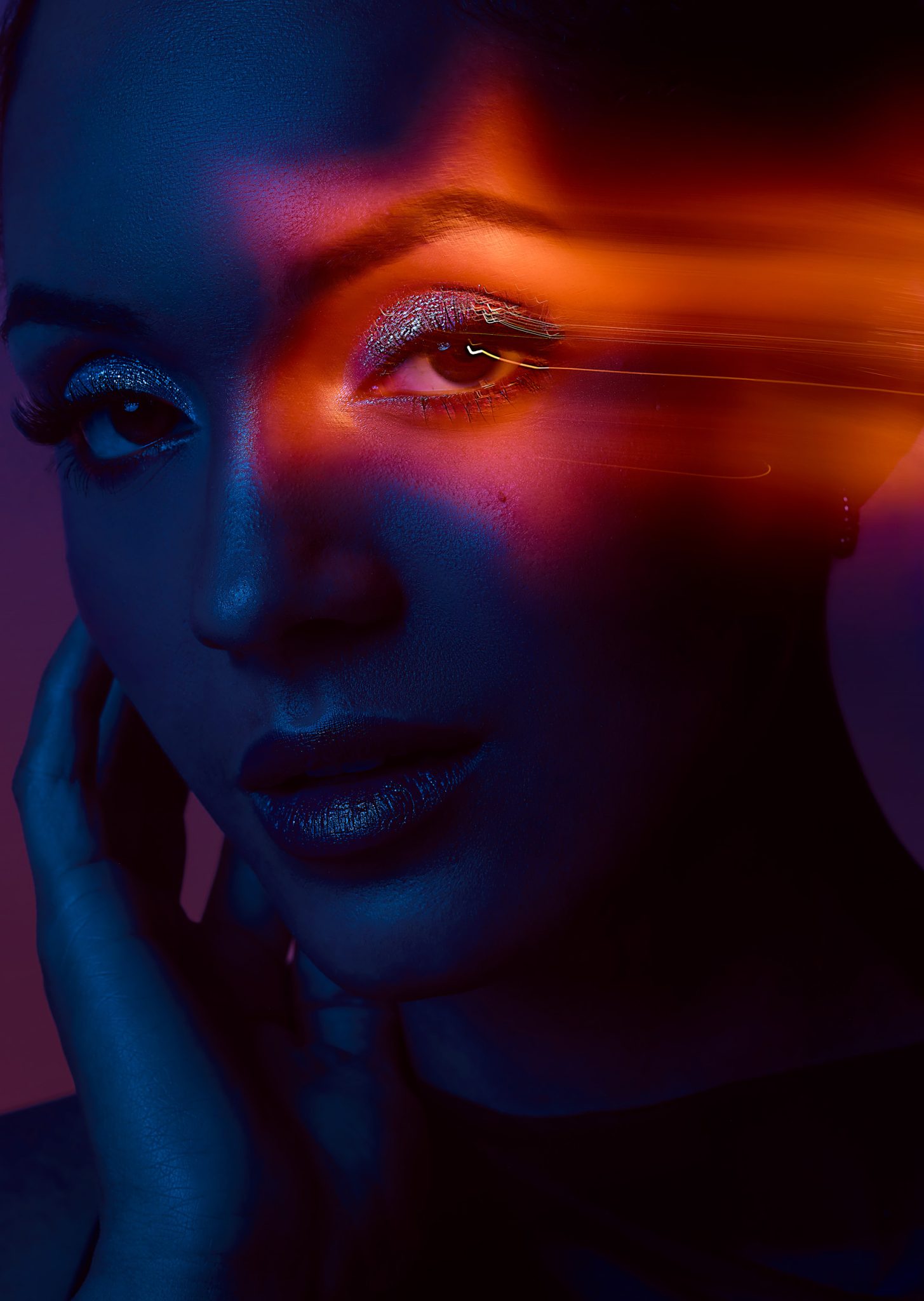 Experimental beauty image using motion blur and layered lighting.