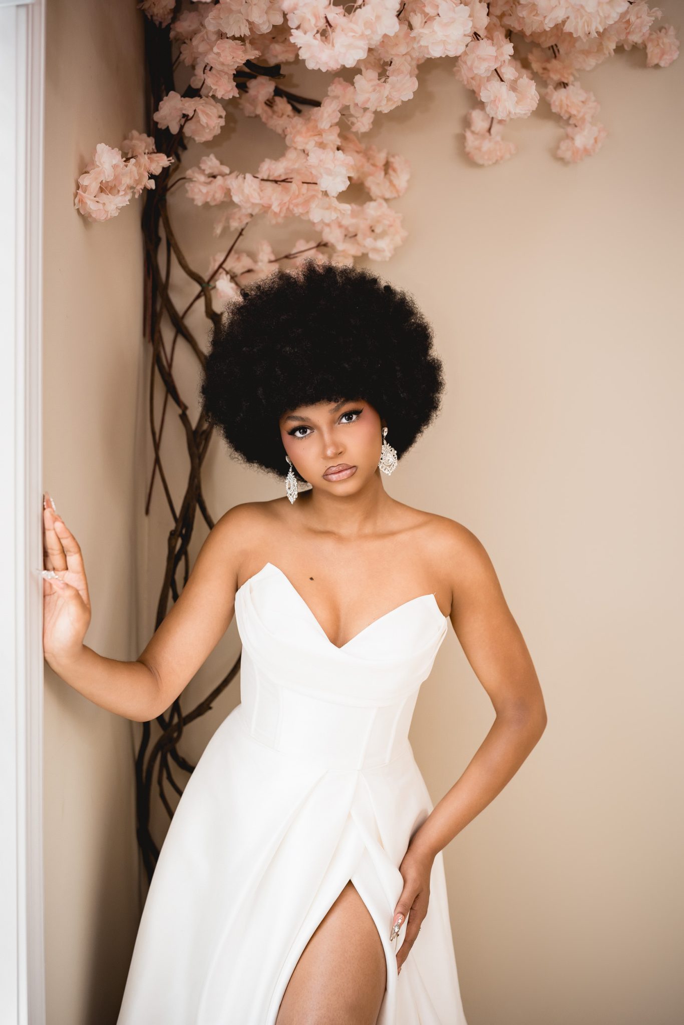 Bounced light from the FJ100 Speedlight softens harsh window shadows for a clean, natural bridal portrait.