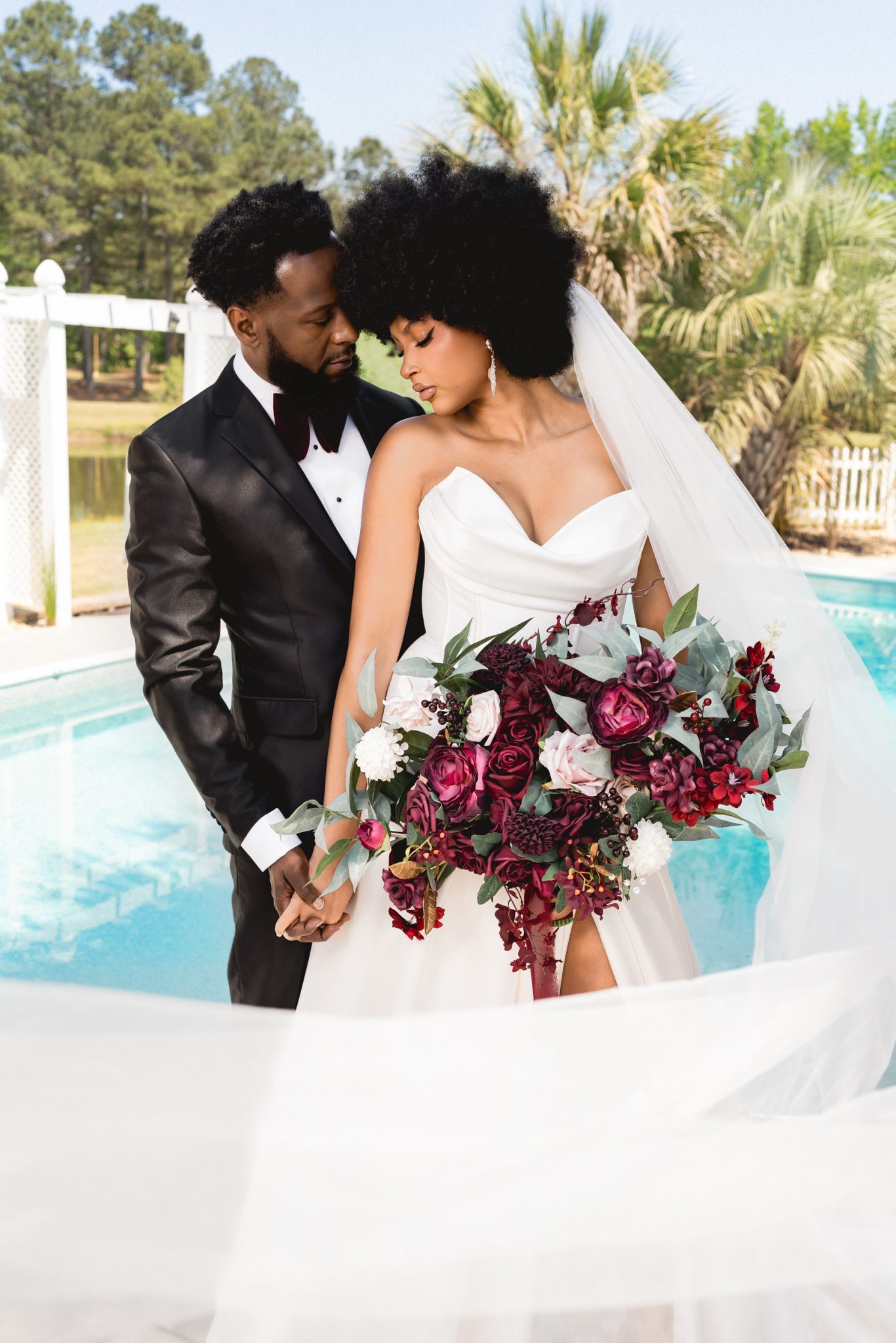 Off-camera FJ100 adds subtle fill to balance the couple with the bright background.