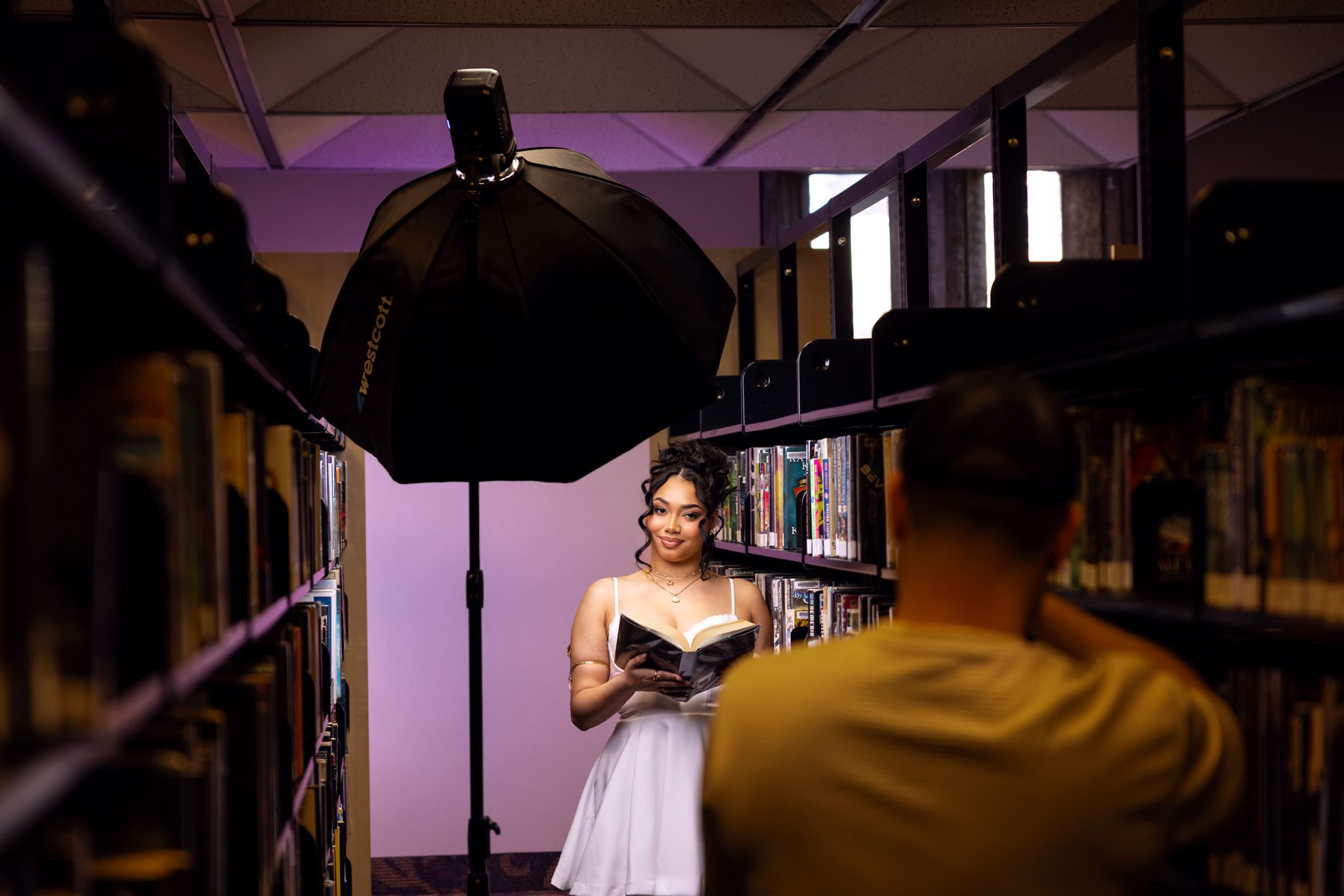 Behind the scenes of setup shows the FJ250 key light with a gelled background light.