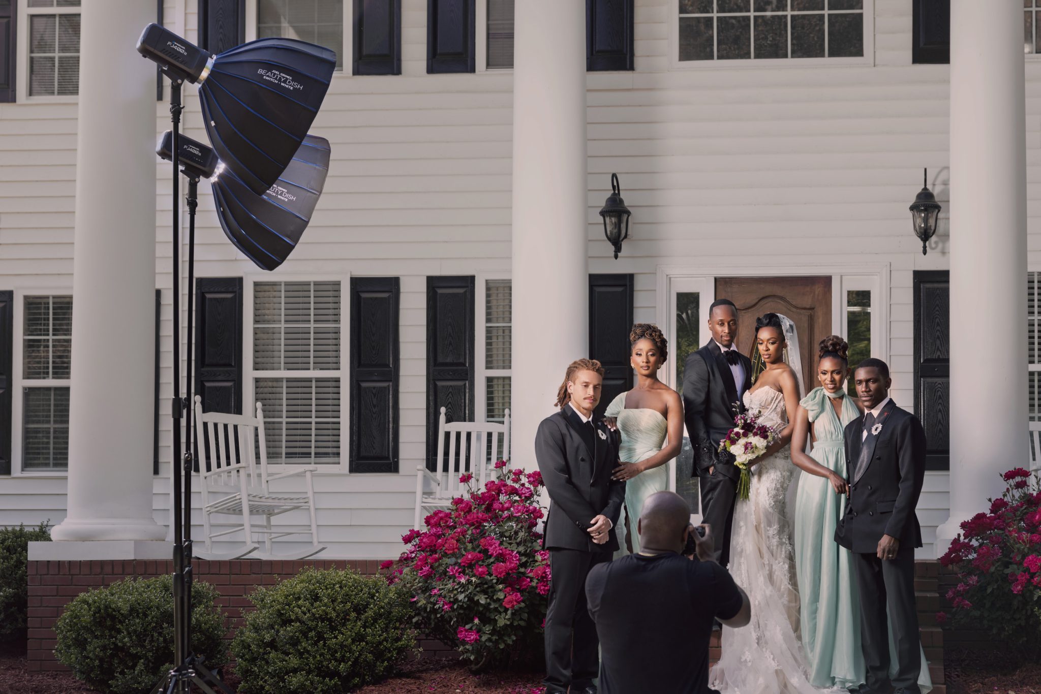 Behind the scenes showing two Westcott FJ400 II strobes with beauty dishes evenly lighting the full bridal party.