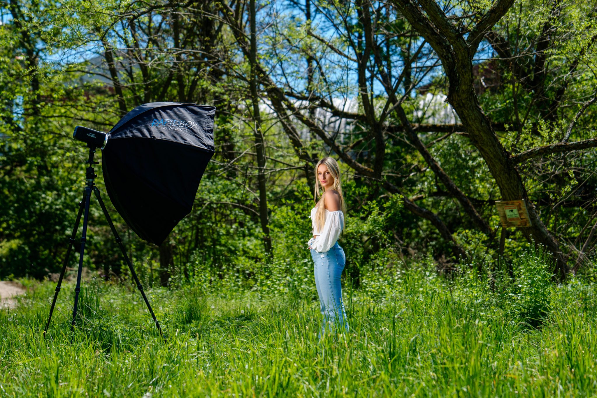 Behind the scenes with the FJ400 II and portable modifier setup in bright midday sun.