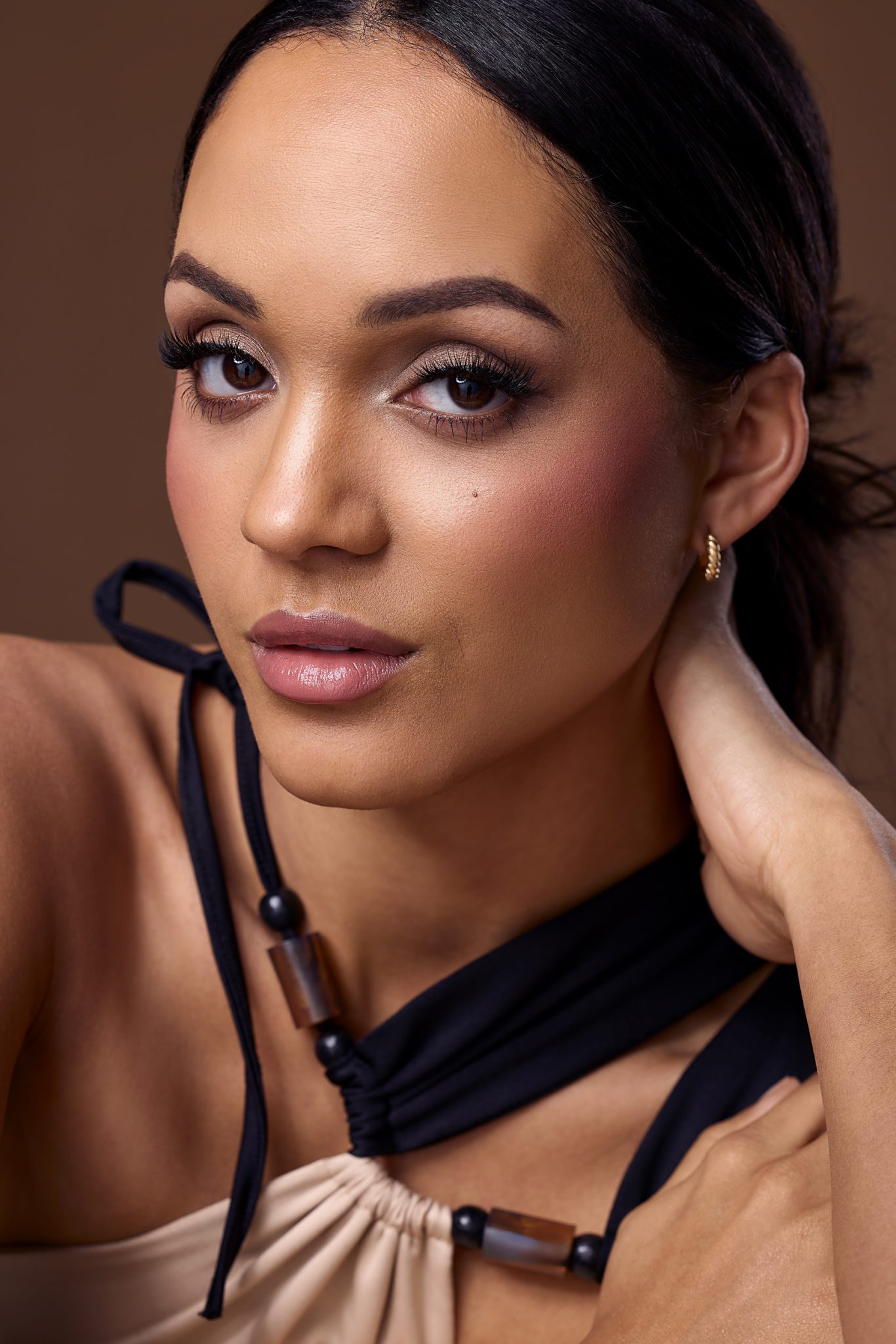 Beauty portrait created by bouncing the Westcott FJ800 strobe off a white wall for soft, natural light.