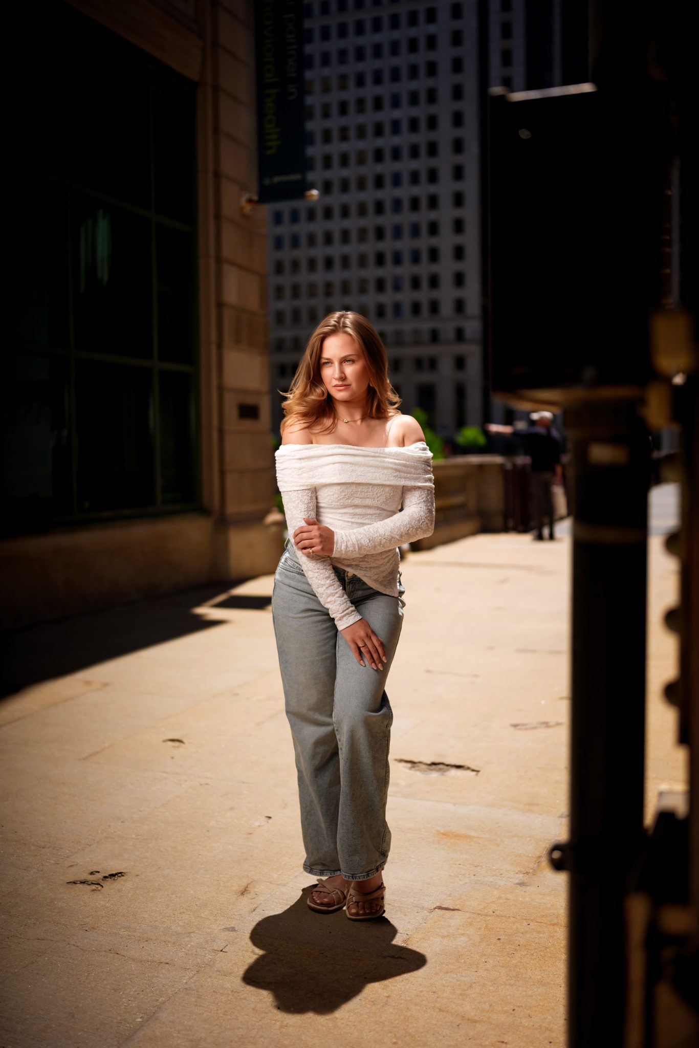 Final portrait uses foreground elements to add depth and frame the subject.