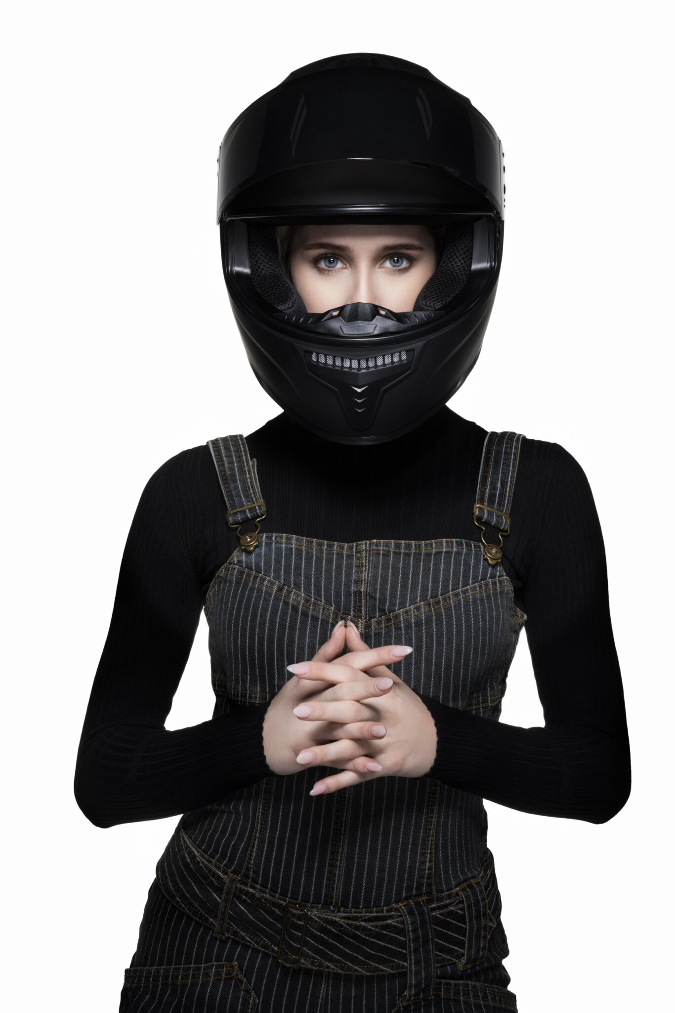Wide aperture shot of a woman in a biker helmet staring at the camera