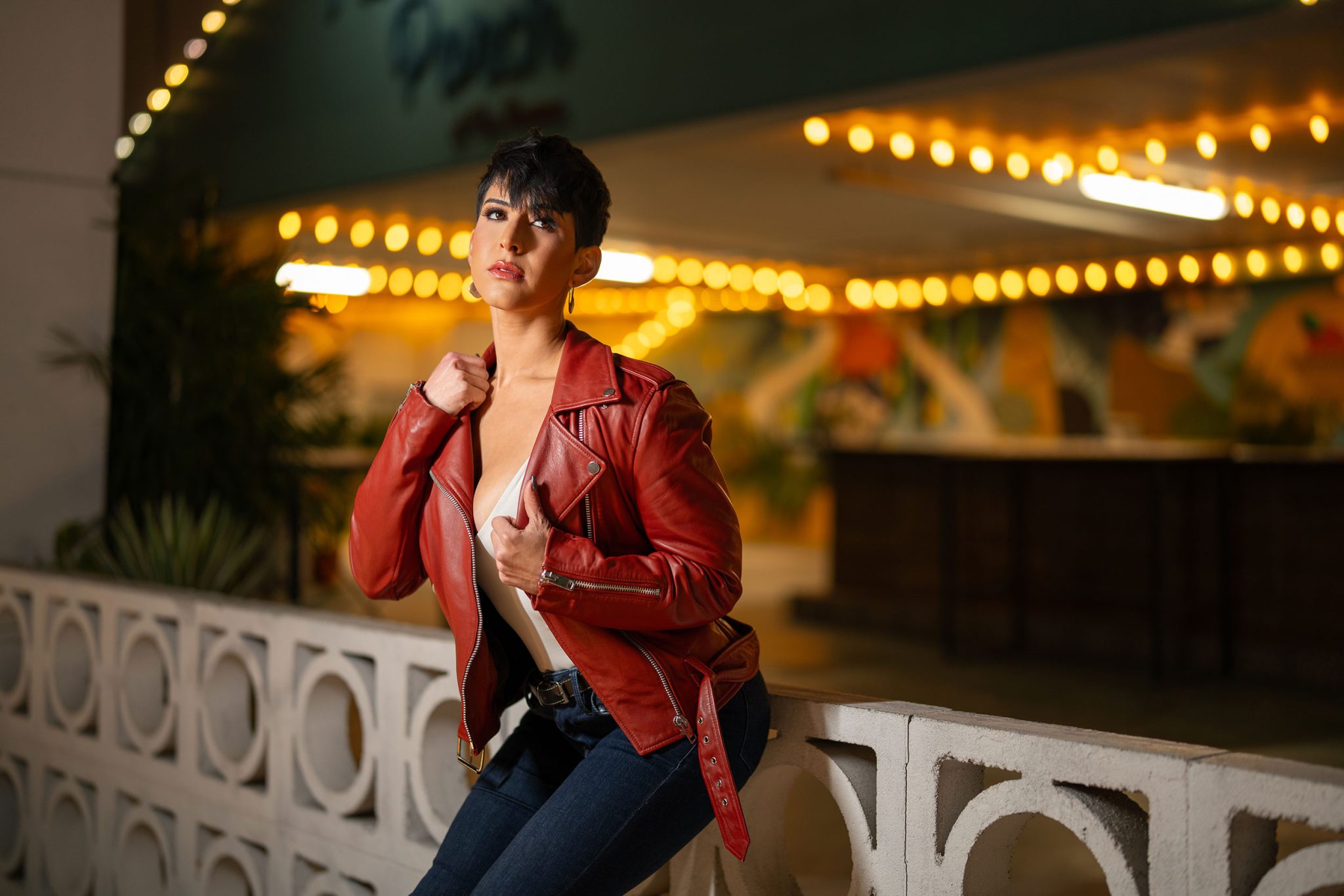 Night portrait under a pergola with the Ice Light 3 shaping the subject while keeping the ambient glow.