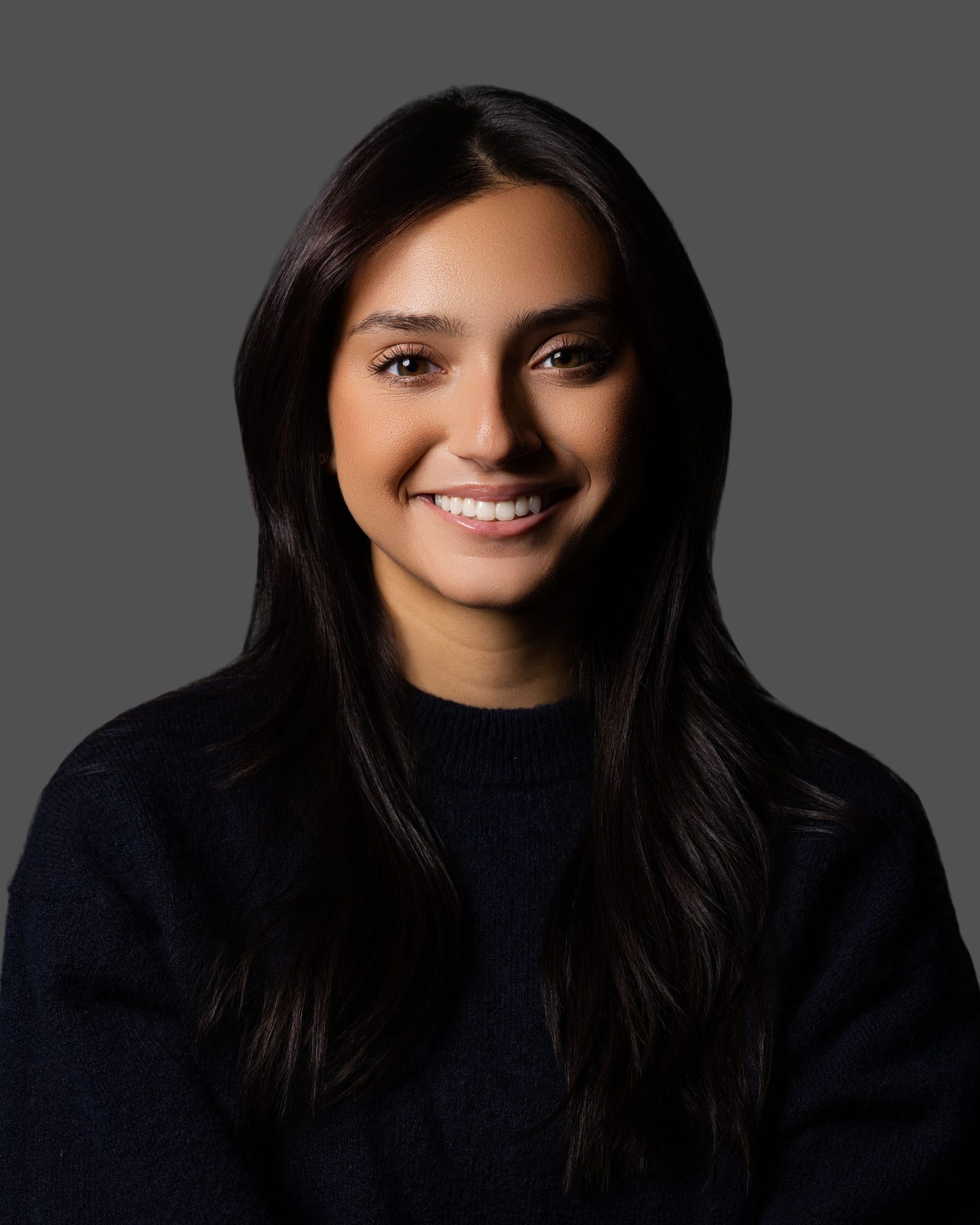 Loop Lighting: Light at a 45-degree angle creating a small shadow off the edge of the nose.