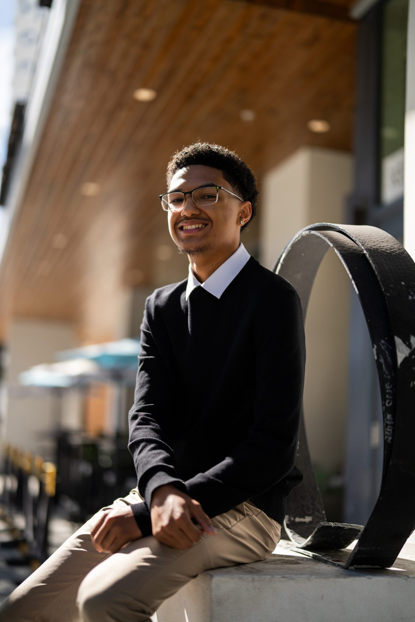 Natural light casts dark shadows across the subject's face.