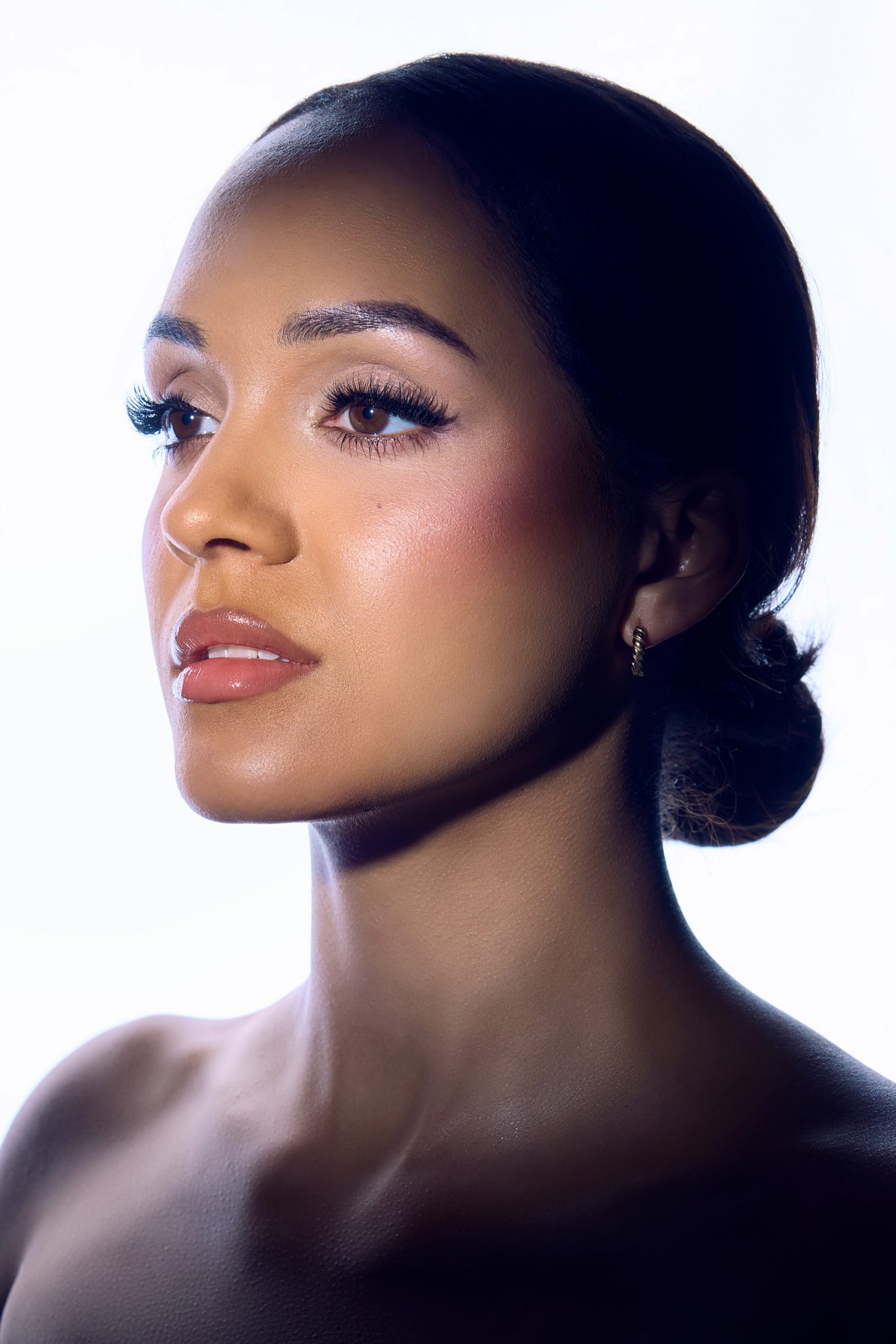 Rapid Box Octa-L back light paired with the Westcott Optical Spot to add focused, dramatic light to the face.