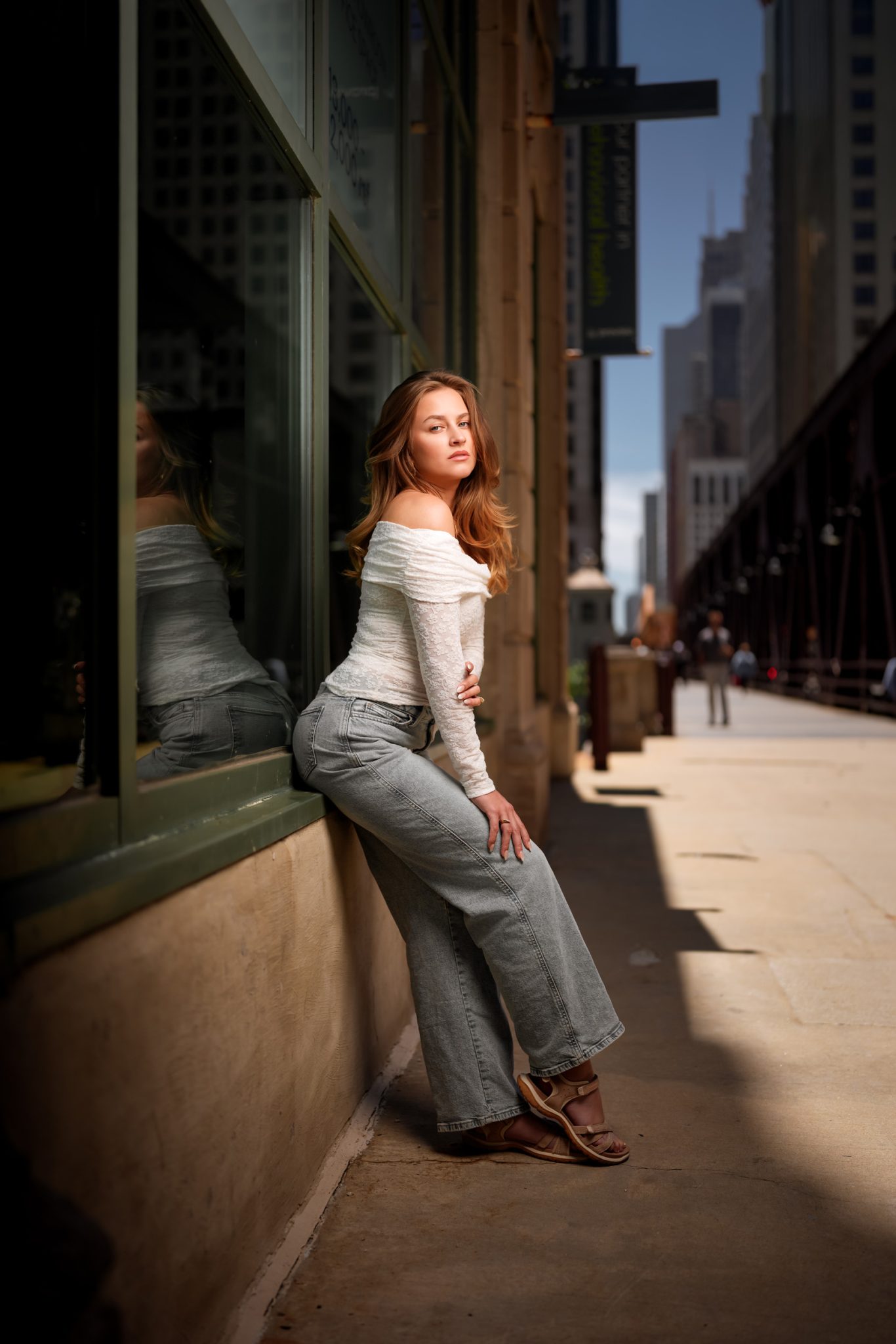 Full body portrait combines strong shadows and flash for a dynamic portrait.