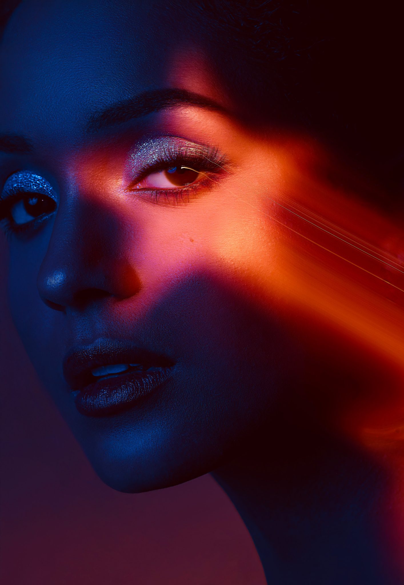 Shutter drag beauty portrait blending flash with motion blur for bold light trails.